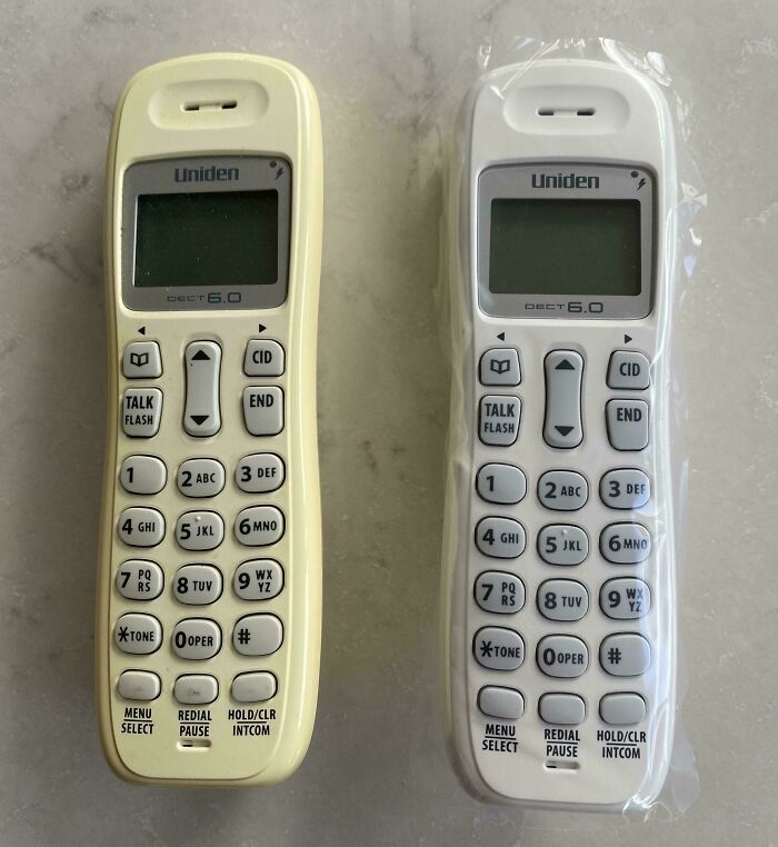 Before-and-after photo of two Uniden cordless phones, one yellowed with age, one new in plastic, how things can change.