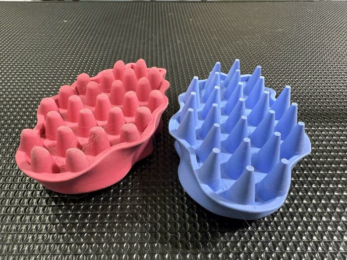 A before-and-after photo of two pet brushes, one pink and worn, the other blue and new, showing how things can change.