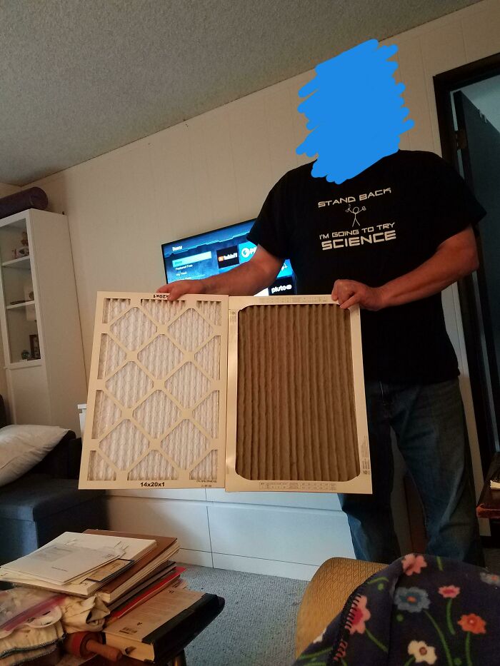 Before-and-after photo of a man holding two air filters, one new and one dirty, showing how much things can change.