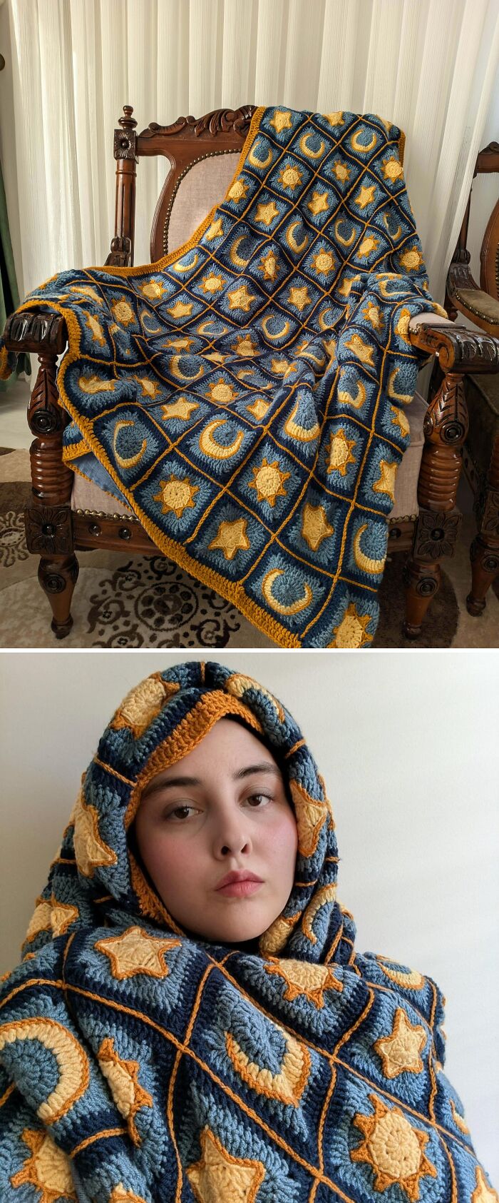 A crocheted blanket with yellow stars and moons on a blue background drapes over a wooden chair, an incredible creation by crochet enthusiasts.