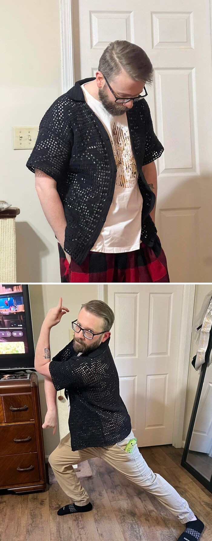 A man wearing an incredible black crochet shirt with a loose weave, showing off the design shared by enthusiasts.