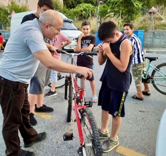 Soul-healing moment: A kind man gives a crying boy a new bicycle after he accidentally dented the man's car.
