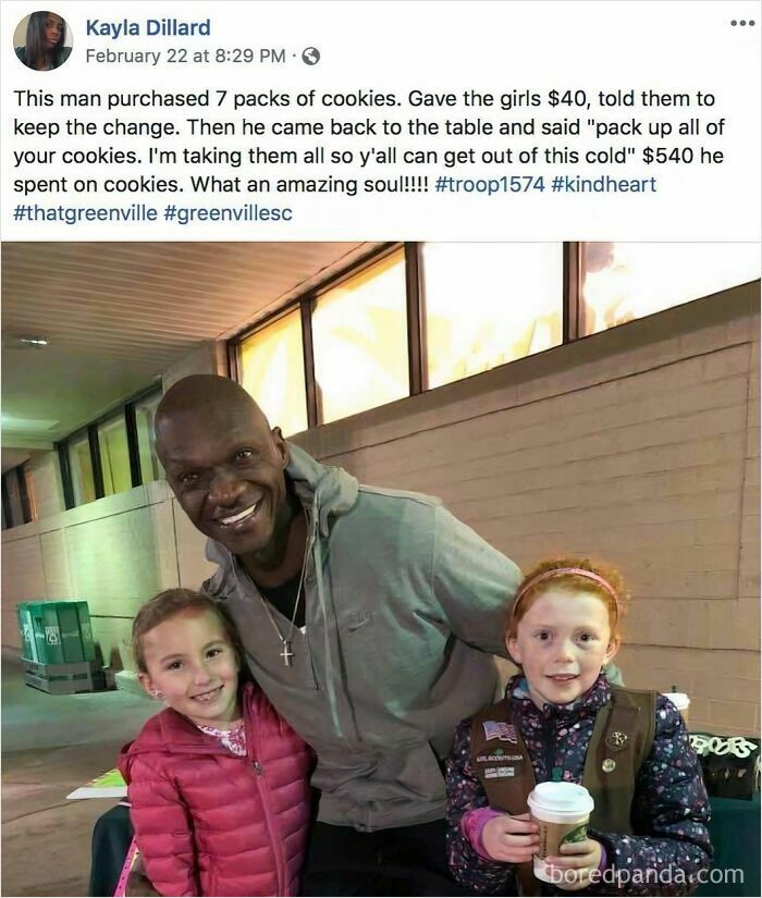 A man smiling with two girls after buying Girl Scout cookies for $540, a soul-healing moment of kindness.