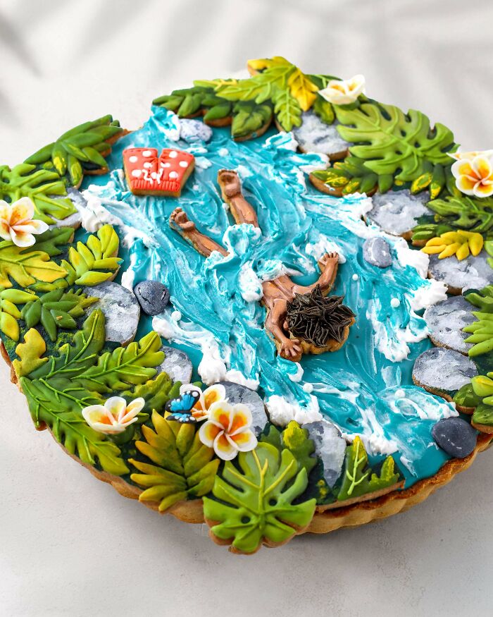 An elaborate treat depicting a person in a blue river with lush green foliage.