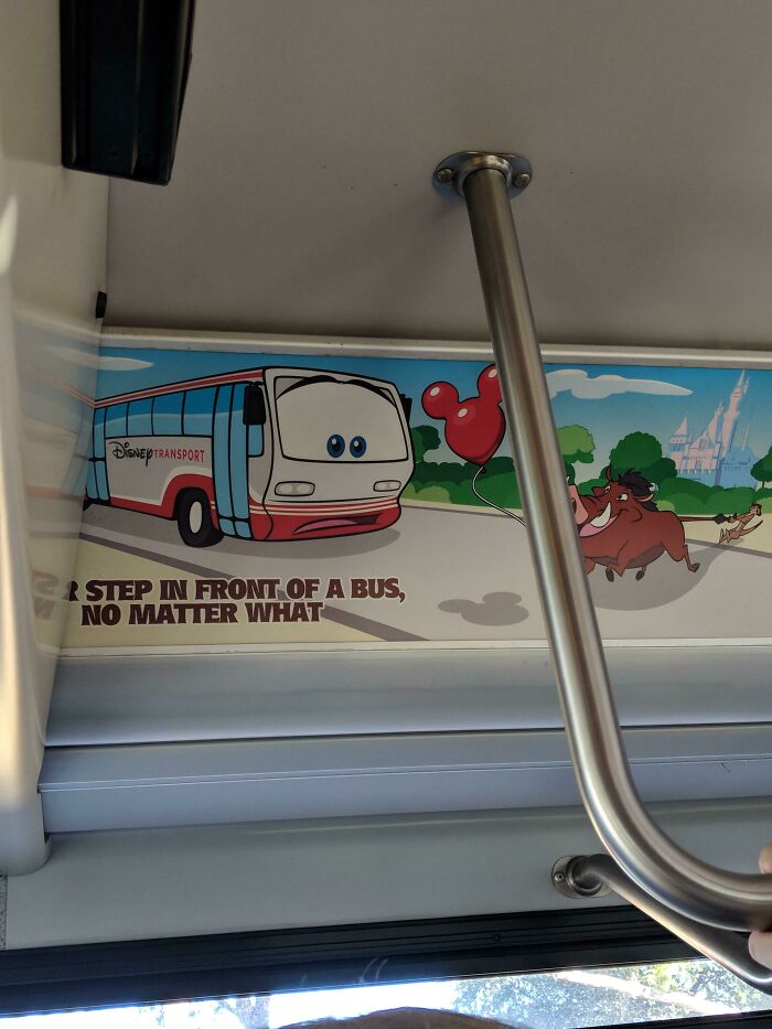 A Disney transport bus advertisement with Pumbaa holding a Mickey balloon, an example of designers failing.