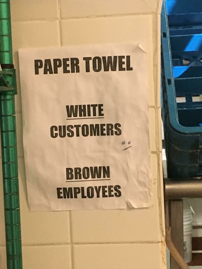 A sign listing paper towel for white customers and brown employees, an epic design fail.
