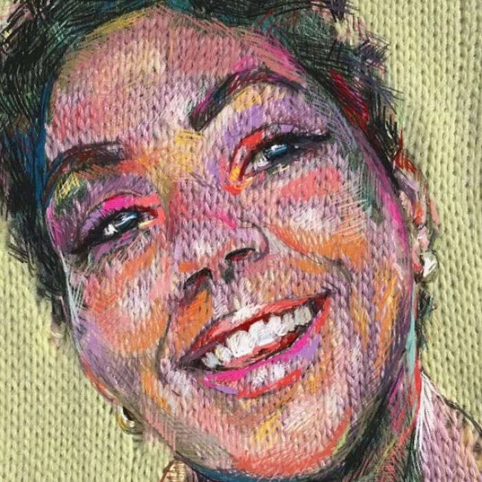 A smiling woman in a colorful knitted portrait, demonstrating the unique blend of traditional knitting and modern art.