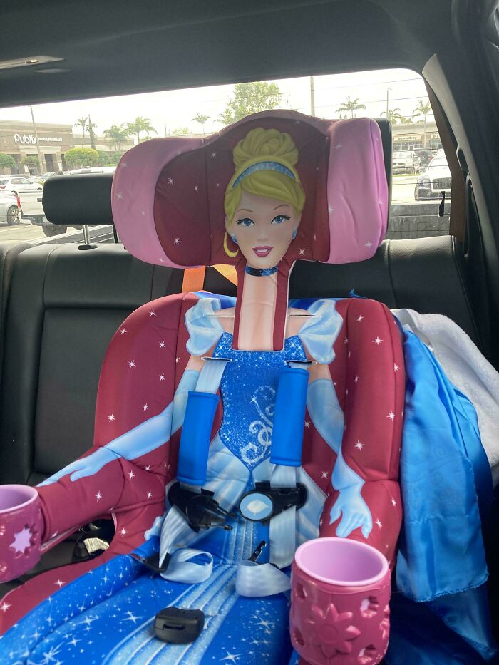 A Cinderella-themed car seat with a disproportionately long neck, an example of a designer failure.
