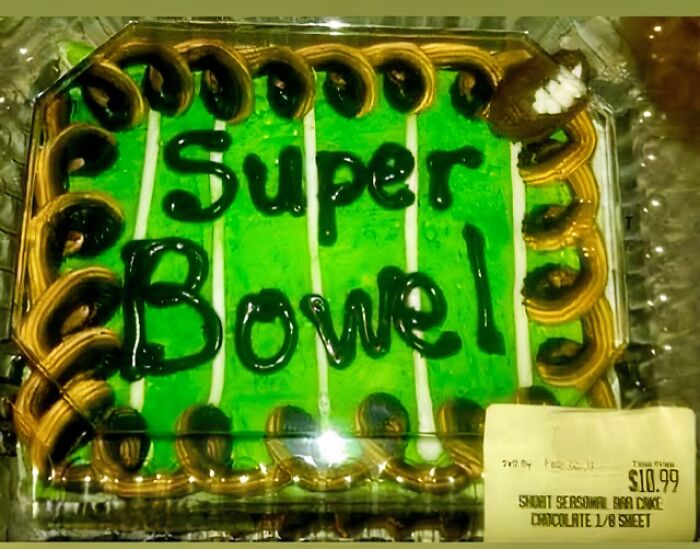 A cake designed to look like a football field, but the writing says Super Bowel, a designer failure.