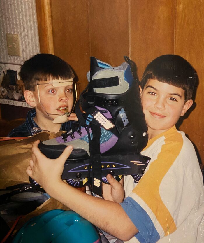 Two 90s kids, one smiling and holding rollerblades, for a throwback meme.