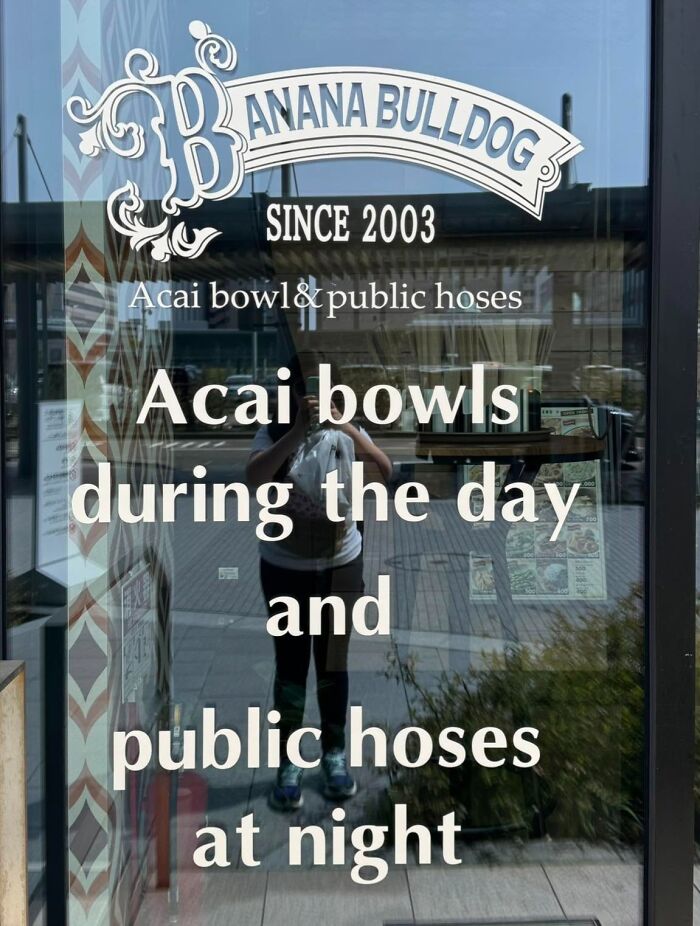 A window of a store called Banana Bulldog in Japan with a hilarious example of getting lost in translation: 'Acai bowls during the day and public hoses at night.'
