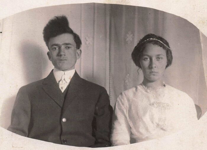 A vintage photo of a man with an impressively tall, gravity-defying, and bad hair mistake.