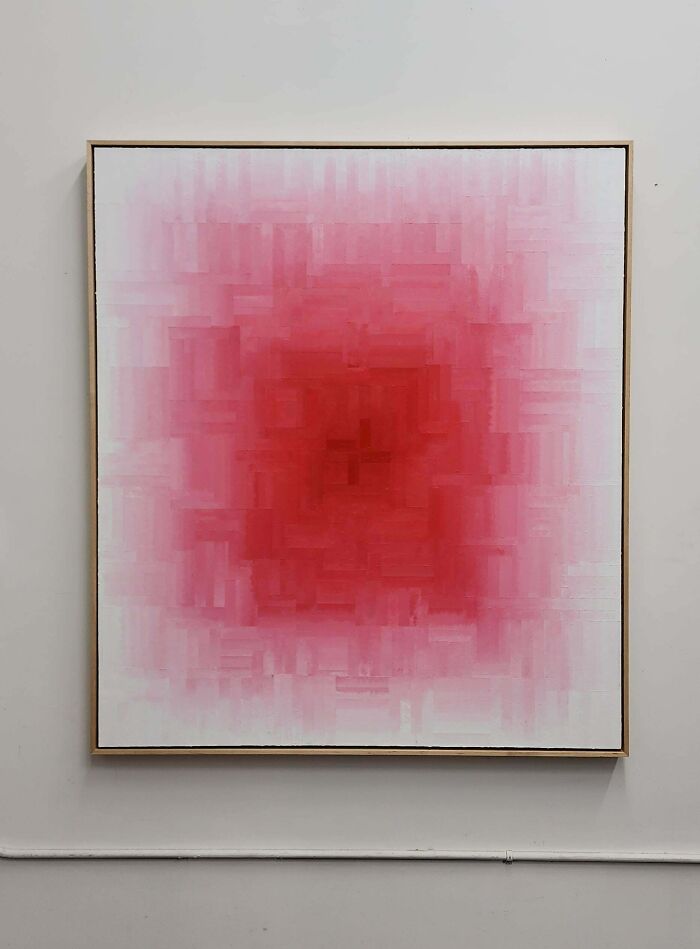 A painting with a bright red square center fading into white, an artistic and talented handmade project.