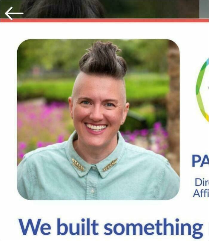 A smiling person with a short, spiky mohawk-style haircut, a bad hair mistake in the past.