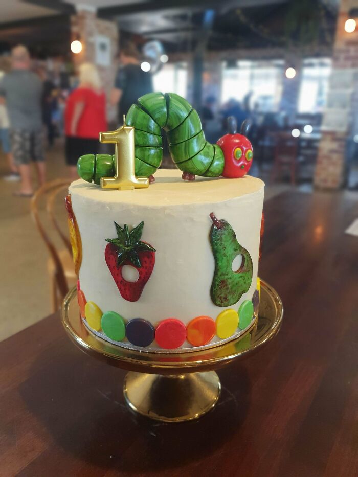 An adorable The Very Hungry Caterpillar cake, a baker's amazing and delicious dessert.