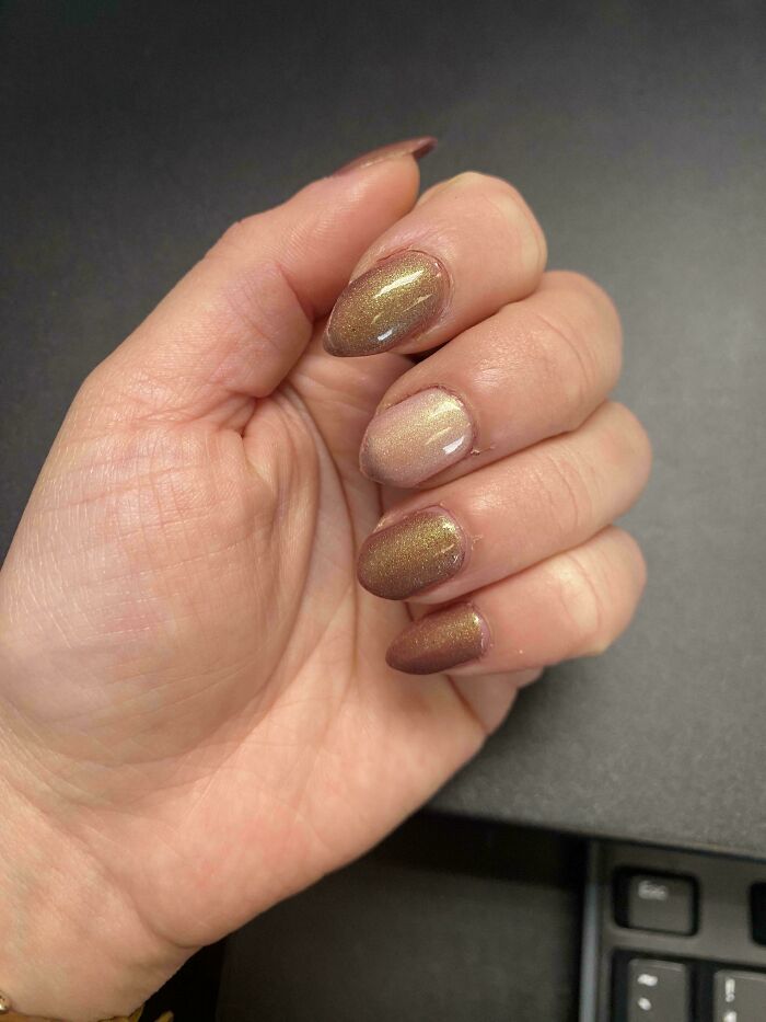 Hand with manicured nails, showcasing the amazing human body.