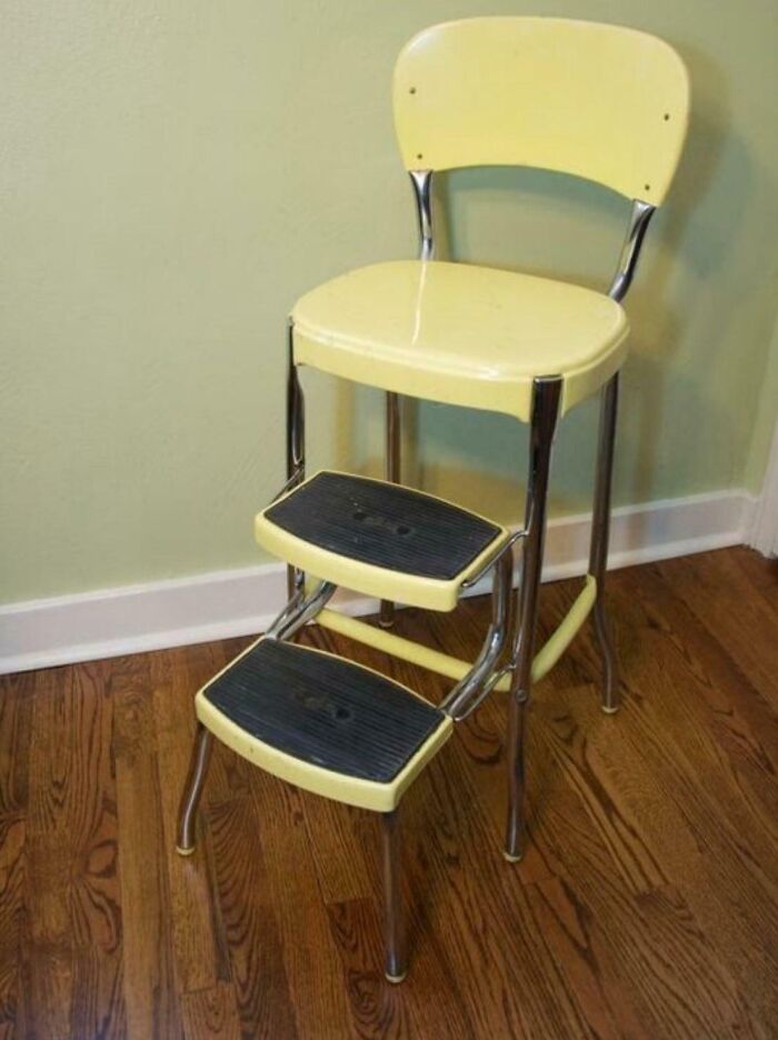 A vintage yellow kitchen step stool chair, a throwback image that will remind you how old you are.