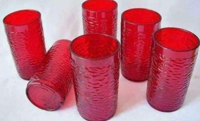 Several iconic red Pizza Hut cups, taking you way back to memorable dining experiences.