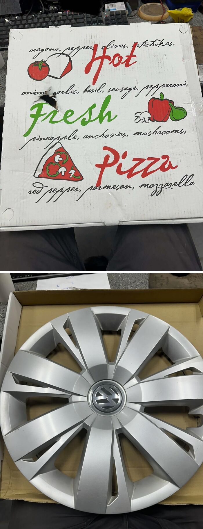 A pizza box containing a car hubcap, an unexpected delivery for car mechanics.