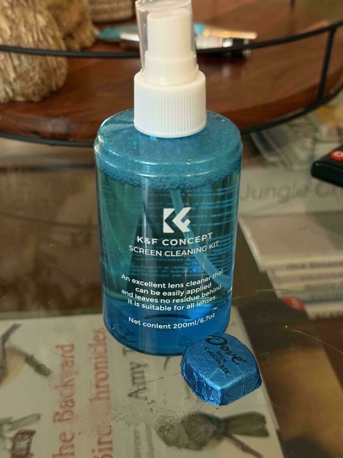 A blue screen cleaning kit bottle beside a blue foil-wrapped chocolate, demonstrating satisfying paint matches.