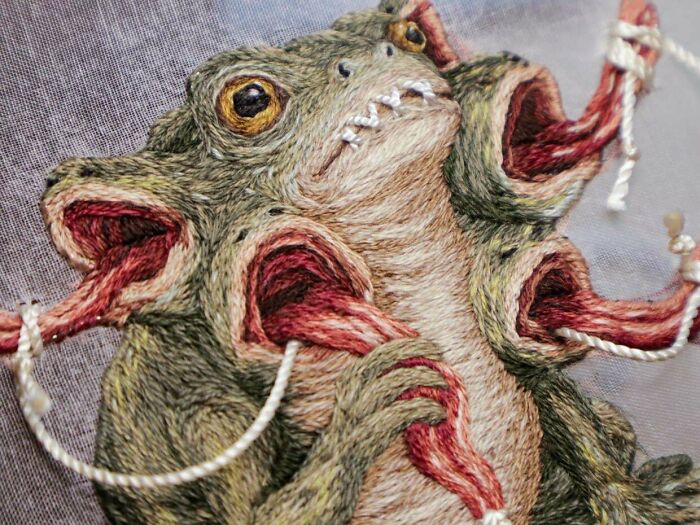 Close-up of a detailed fantasy monster creature created with complex embroidery projects stitches
