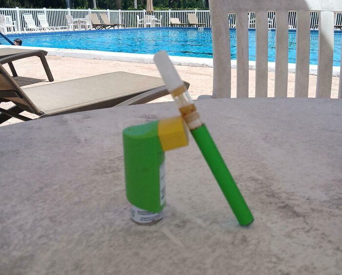 A green and yellow object on a table, perfectly matching the colors of a nearby swimming pool. Satisfying paint matches.