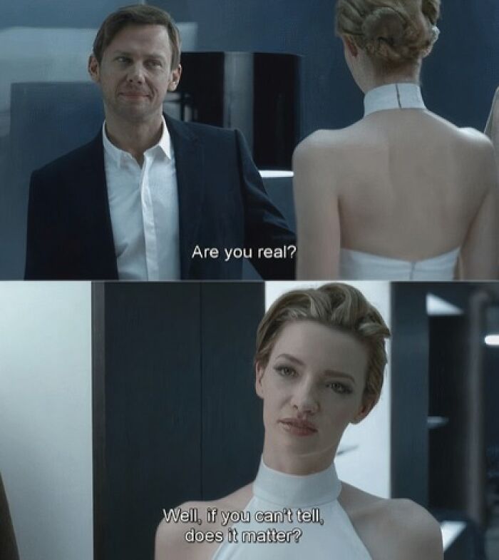A funny AI meme from a movie scene where a man asks Are you real? and a woman replies Well, if you can't tell, does it matter?
