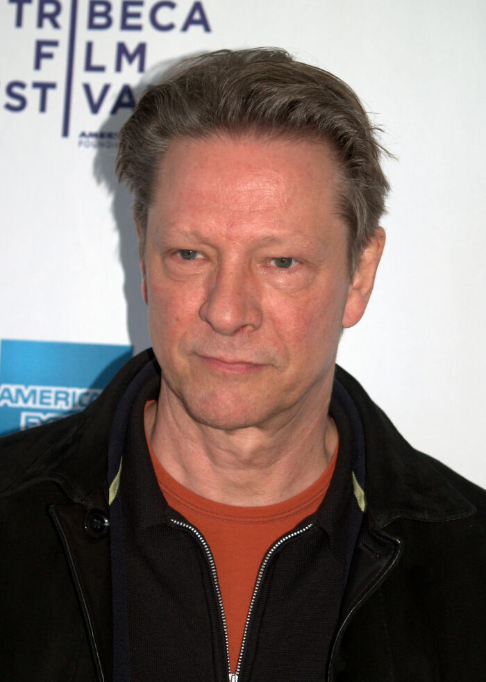 Chris Cooper posing for a photo with a serious expression at a film festival, highlighting his bio and career.