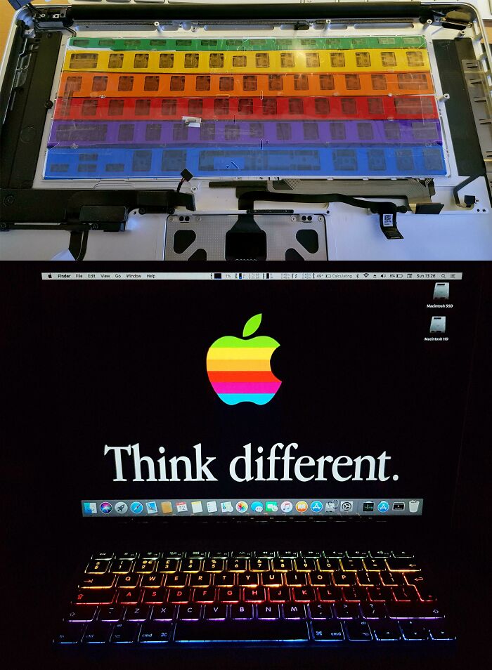 An open laptop revealing rainbow-colored plastic sheets and a screen displaying Apple's Think Different slogan, a wild fix.