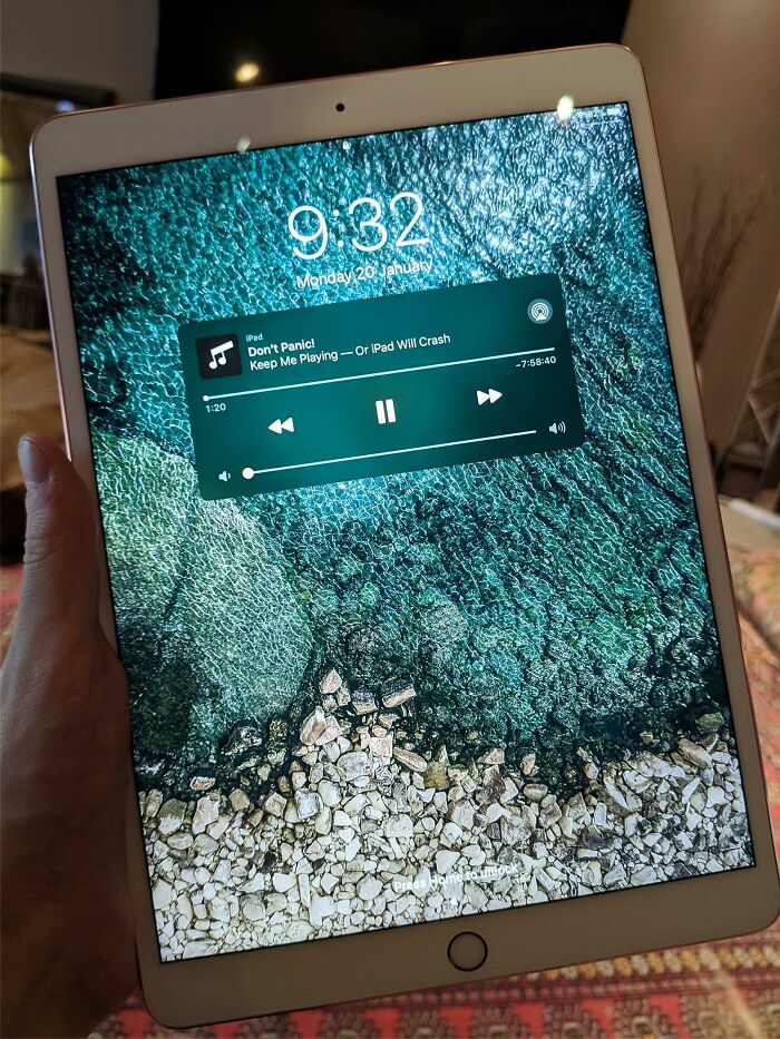 A wild and unhinged way to fix a broken iPad screen by displaying a calm background and music player.