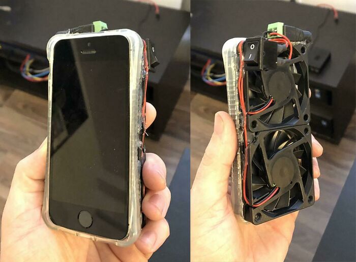 A smartphone with attached cooling fans on its back, a wild way to fix something.
