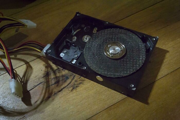 An open hard drive with an abrasive disk, a wild way to fix something.