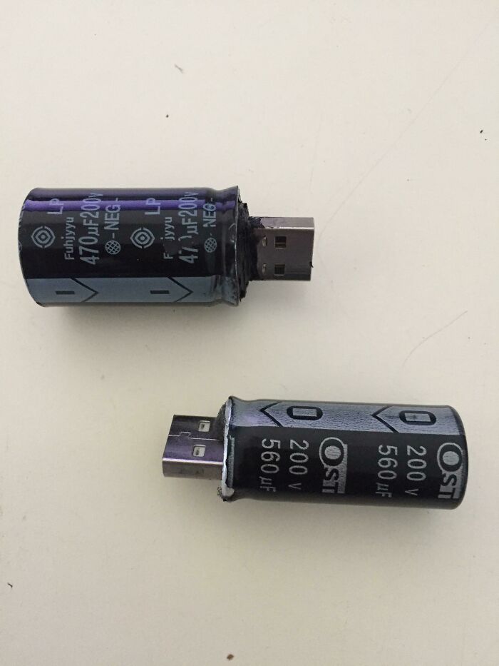 Two USB drives fashioned from large capacitors, showcasing a wild and unhinged way to fix storage.