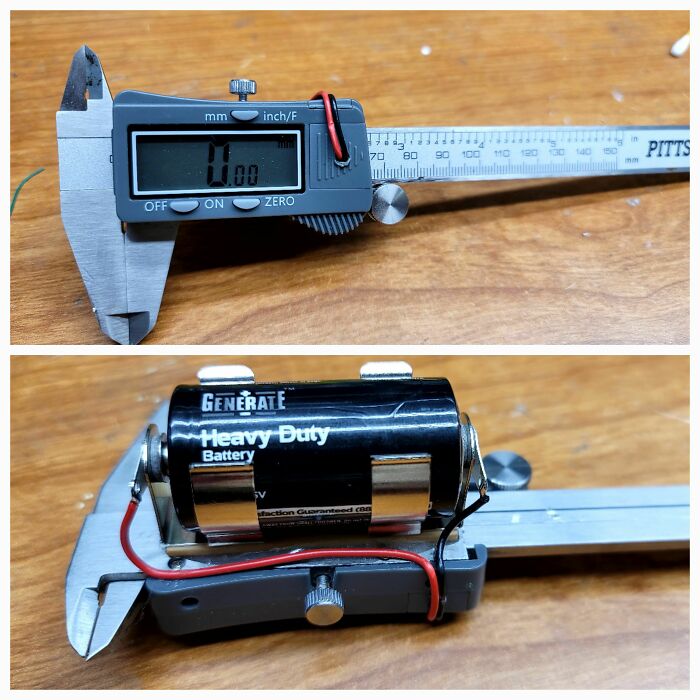 Digital calipers being used as a battery holder, a wild and unhinged way to fix something.