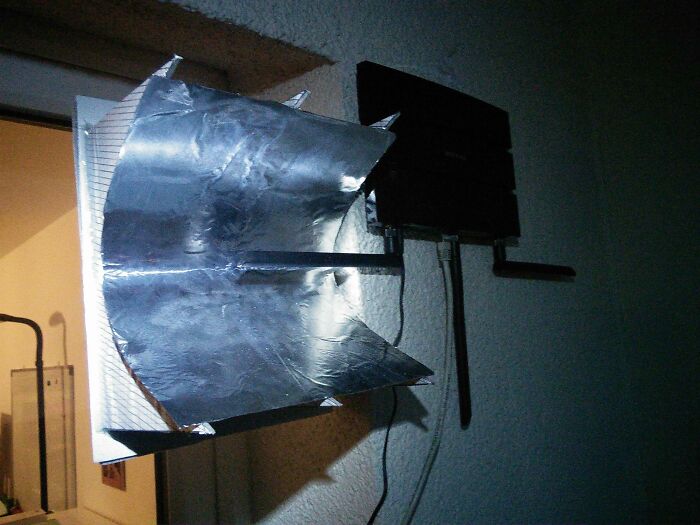 Wild and unhinged way to fix a Wi-Fi signal using aluminum foil on an antenna.