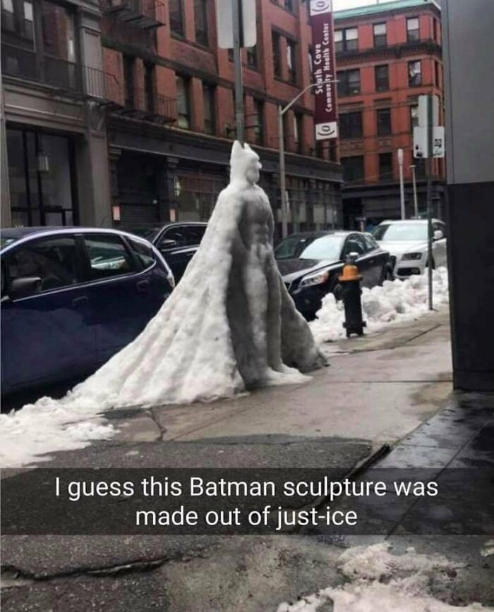 A snow sculpture of Batman with the caption, I guess this Batman sculpture was made out of just-ice, a clever incredibly dumb pun.