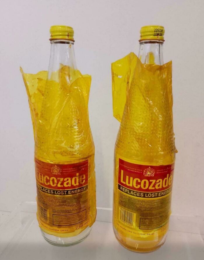 Two glass bottles of Lucozade, a popular energy drink, bringing back good memories of life in the 80s.