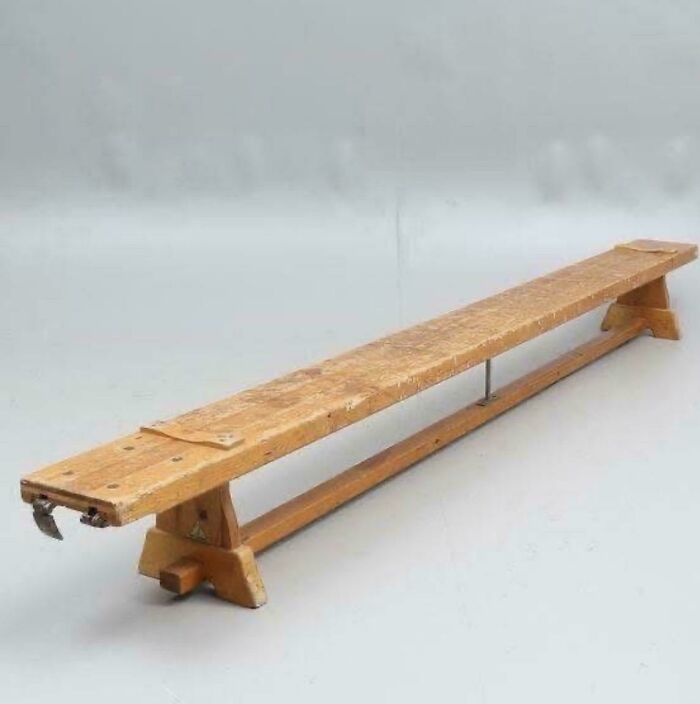 A vintage wooden balance beam, reminiscent of physical education and good memories of life in the 80s.