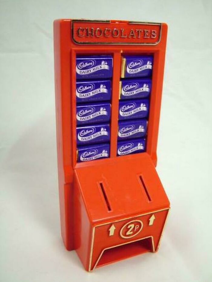 A vintage red Cadbury Dairy Milk chocolate vending machine, bringing back good memories of life in the 80s.