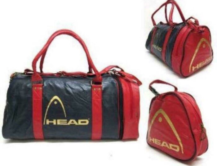 A collection of black and red HEAD brand duffel bags, reminiscent of the popular styles of life in the 80s.