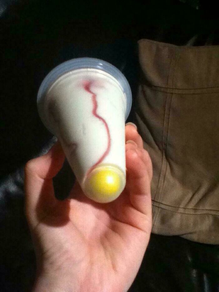 A vintage push-up ice cream with a gumball, a sweet treat from the '80s that brings back good memories.