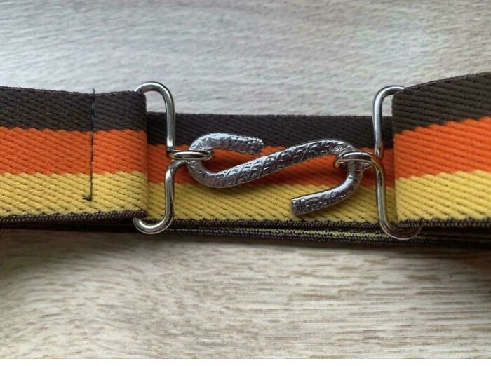 A vintage belt with an S-shaped metal buckle, evoking good memories of life in the 80s.