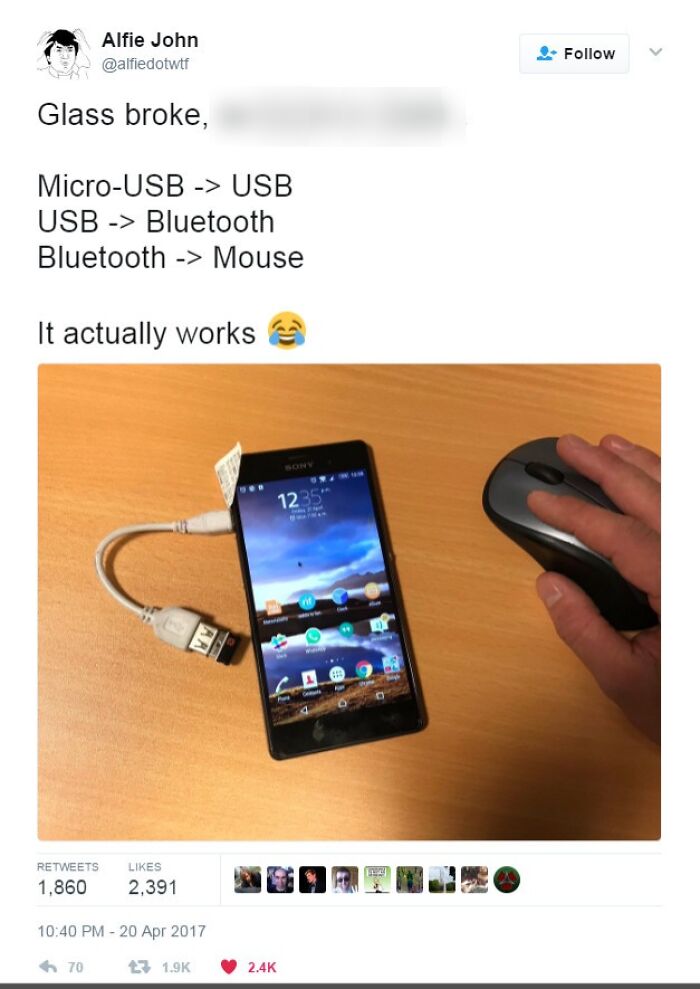 A smartphone connected to a mouse via multiple adapters, showcasing a wild way to fix something.