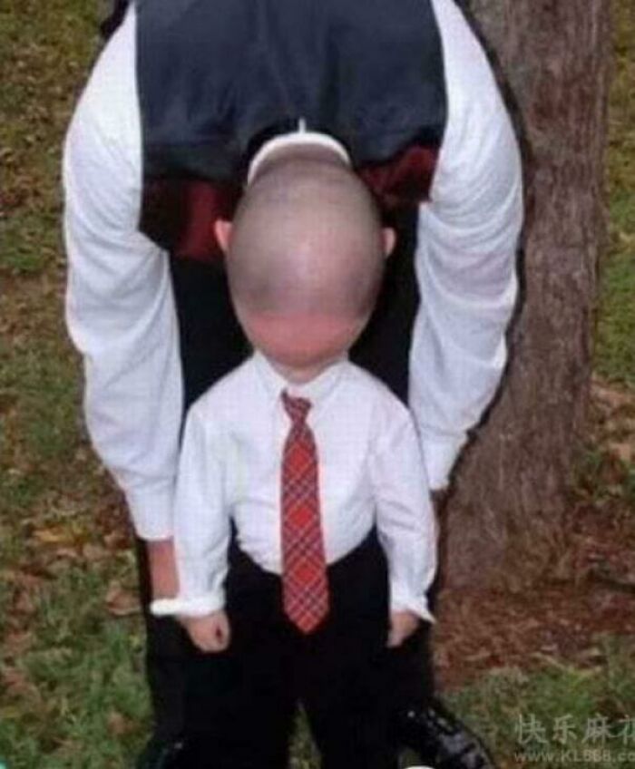 A child's head appears to be inverted on an adult body, a photo you may need to look twice at.