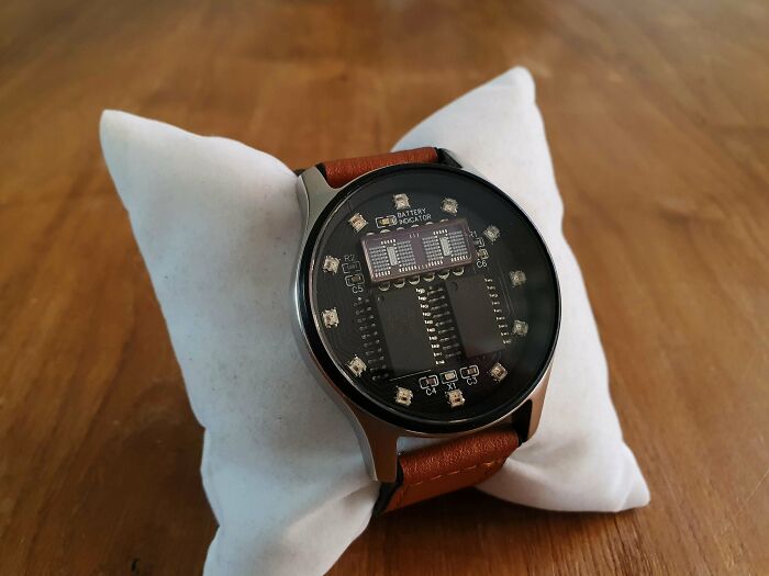A sophisticated smartwatch with an exposed circuit board face, a 3D printing creation.