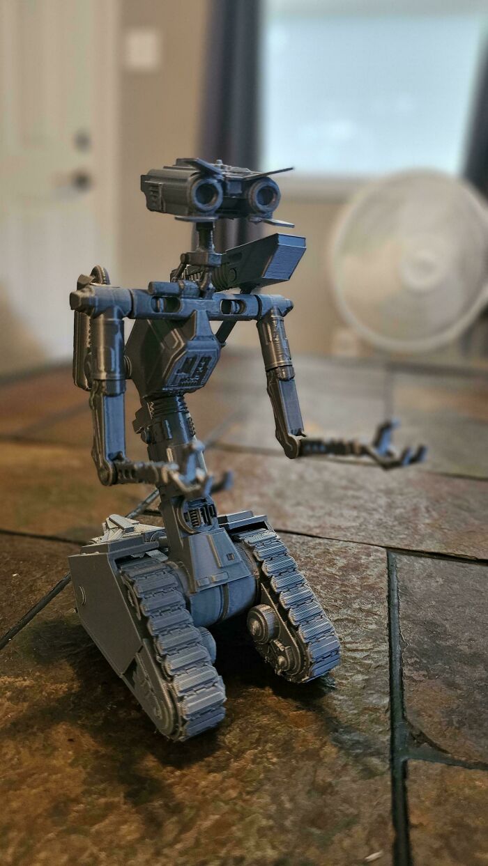A detailed 3D printing creation of Johnny 5 from Short Circuit, an amazing robot creation.
