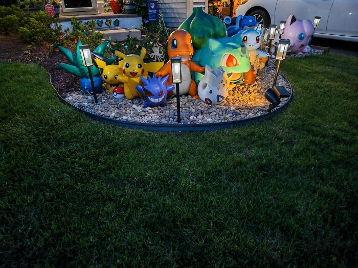 Amazing 3D printing creations: large Pokémon figures like Pikachu, Charmander, and Bulbasaur displayed in a garden.