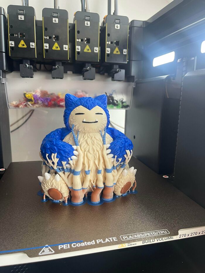 Amazing 3D printing creation of a large, detailed Snorlax figure being printed on a 3D printer.