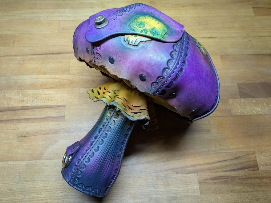 A vibrant, mushroom-shaped whimsical craft with purple and yellow hues, magical and shared online.