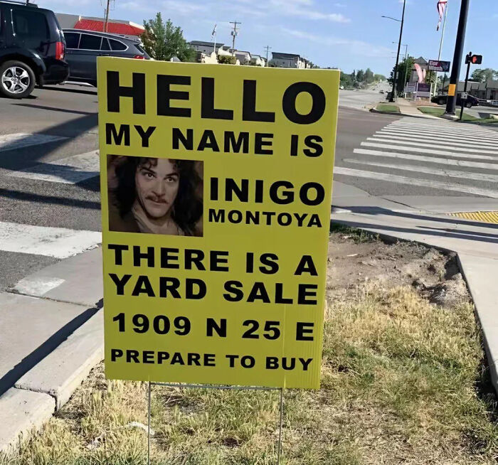 A yard sale sign reads Hello, My Name is Inigo Montoya, with his picture. A funny meme for your health.